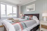Willow Lodge double bedroom - Florence Springs Luxury Lodges, Tenby, Pembrokeshire, South West Wales